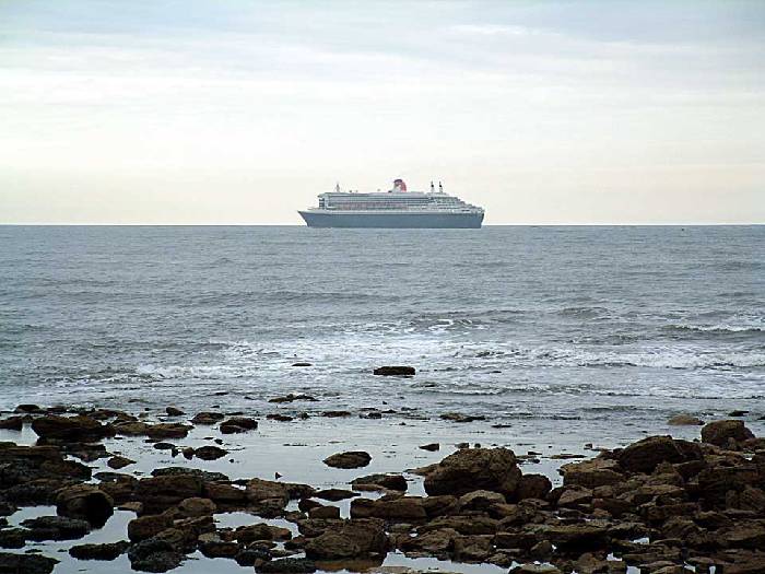 Queen Mary 2 heading north away from Tynemouth. 12 july 2004